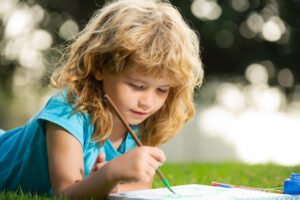 Girl painting outdoors